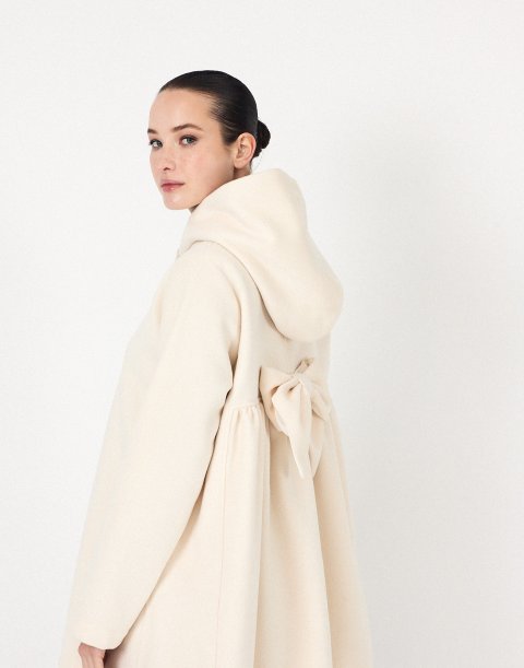 Coat with bow