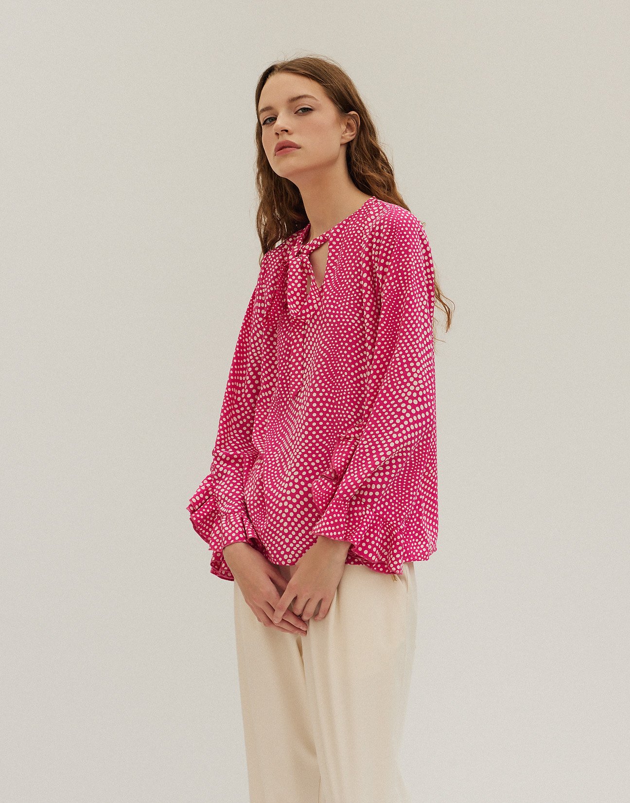 Ruffled polka dot blouse